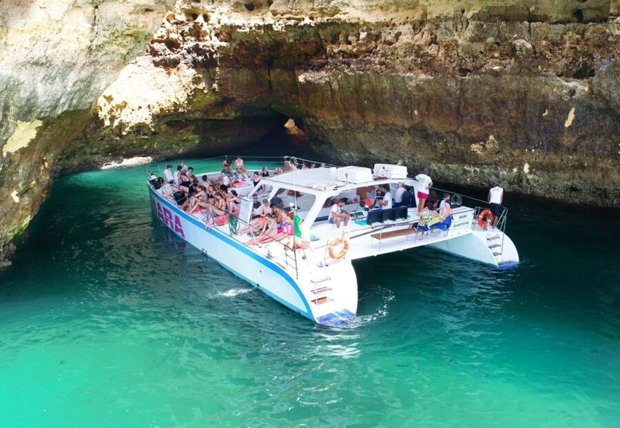 Albufeira: Caves and Coastline Catamaran Cruise to Benagil - Music, sparkling wine, and the ride back