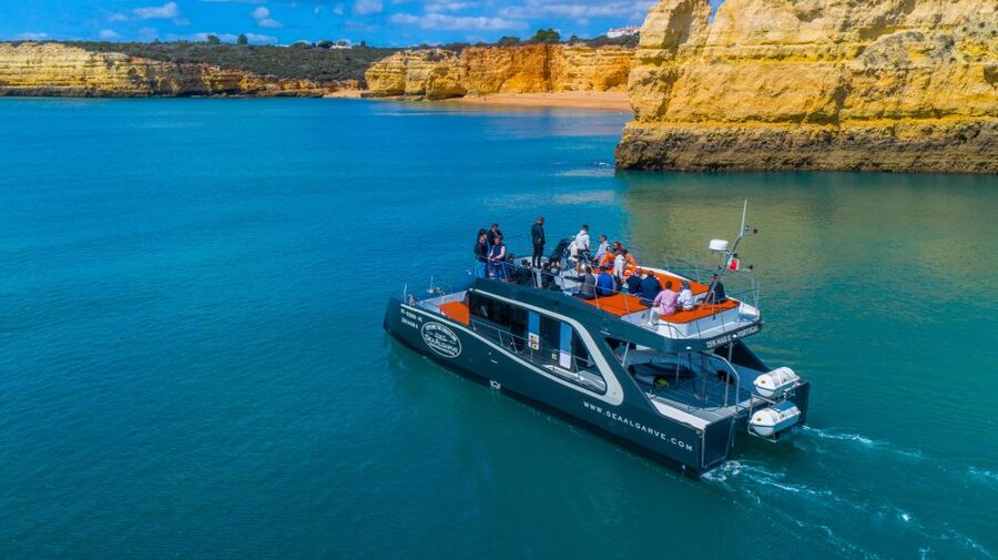 Albufeira: Coastline and Benagil Caves Tour by Catamaran - Reaching Benagil and its famous sea cave