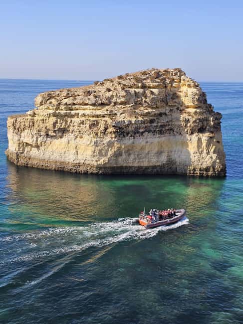 Albufeira: Dolphin Watching and Benagil Cave Boat Cruise - Entering Benagil Cave by small boat