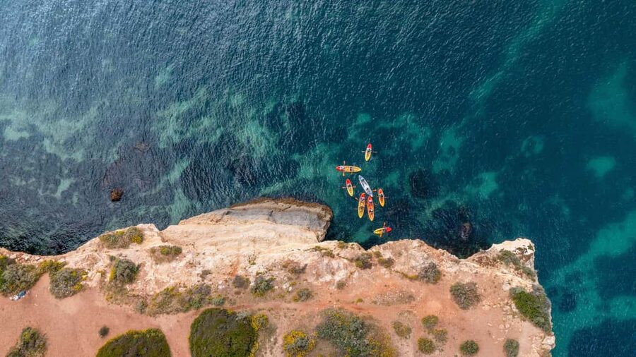 Albufeira Marina: Benagil Cave to Marinha Beach Kayak Tour - Swimming from a small beach and the catamaran