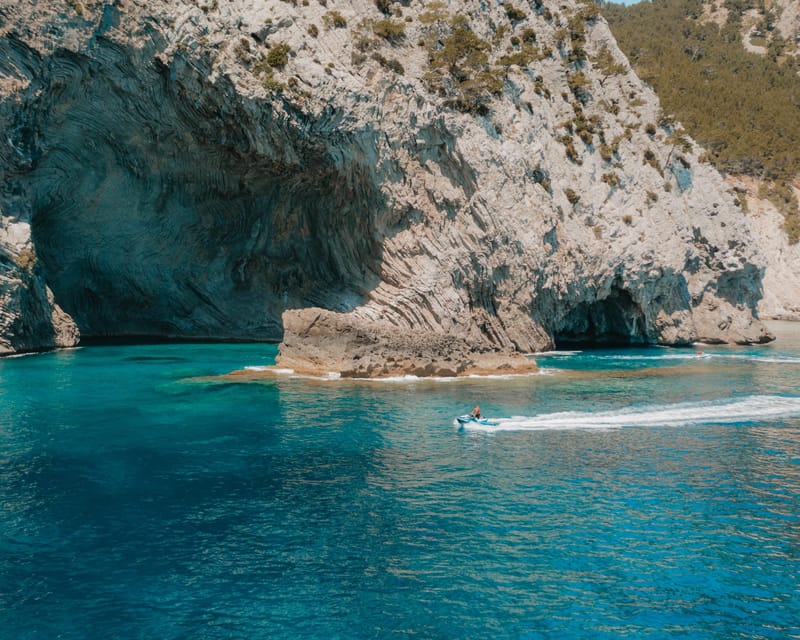 Alcudia: JetSki Tour Coll Baix beach & Caves (free Photos) - Alcanada lighthouse island and the first photo stop