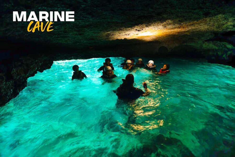 Alcudia: Kayak Tour with Snorkel & Sea Cave Swim - Sea caves, rock walls, and a swim inside