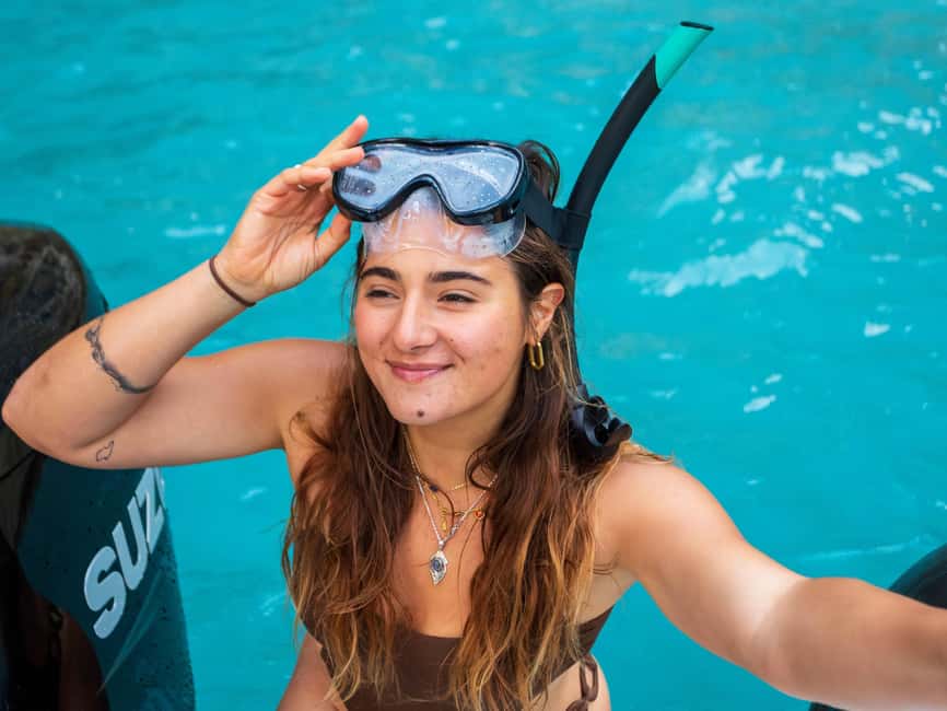 Alcudia: Sightseeing, Sea Caves & Snorkel Speedboat Tour - Coll Baix: beach views, swimming, and snorkeling