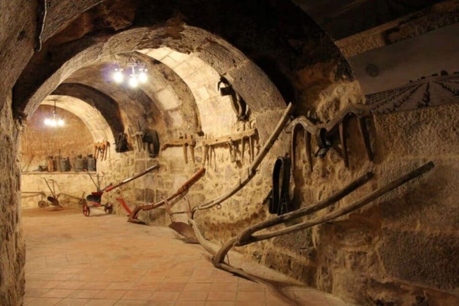 Aranda de Duero: Tour of Underground Cellar and Wine Museum - Going below street level into the 13th-century cellar