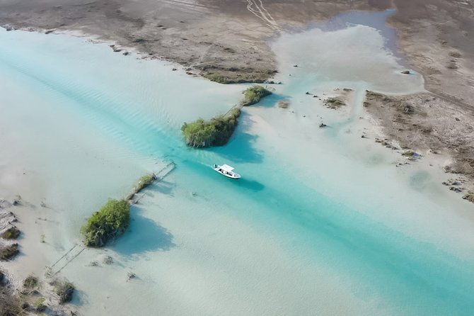 Bacalar Boat Tour and Visit to Cenotes - A small boat and a bilingual guide
