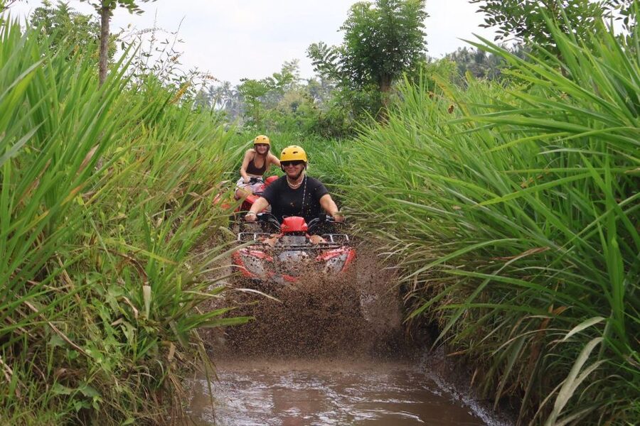 Bali: ATV Gorilla Cave, Ubud Monkey Forest, & Waterfall Tour - Cooling off at Tegenungan Waterfall