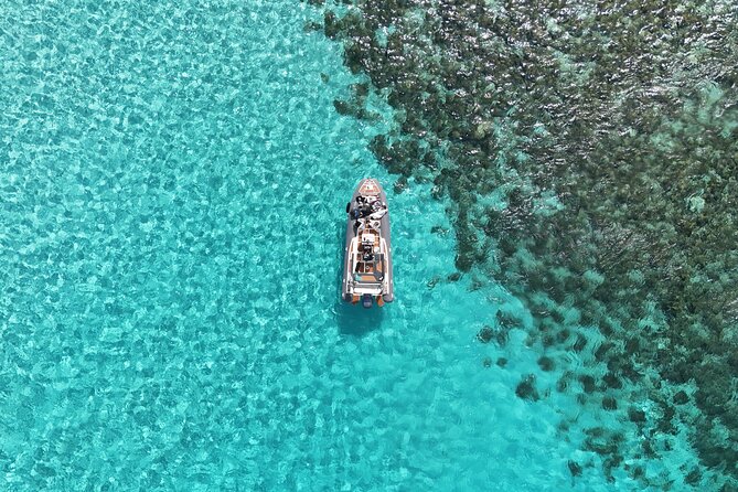 Blue Lagoon, Comino and Caves Tour with Private Rib Boat - Crystal Lagoon, cliff jumps, and the P31 wreck