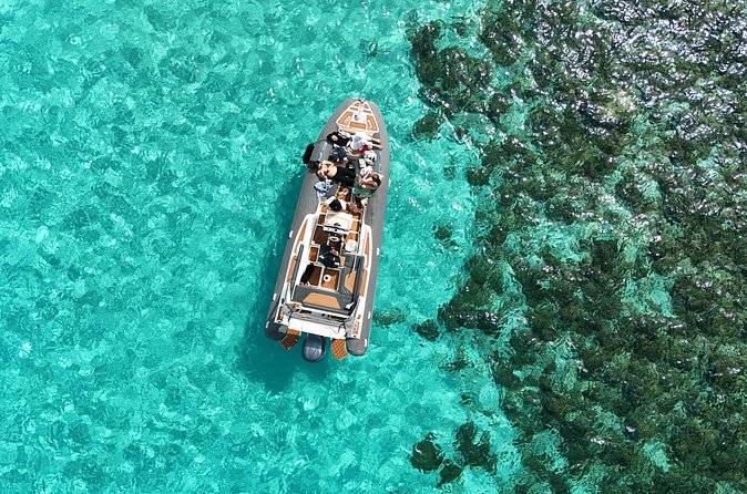 Blue Lagoon, Comino and Caves Tour with Private Rib Boat - Cominotto Reef and the islet across the lagoon