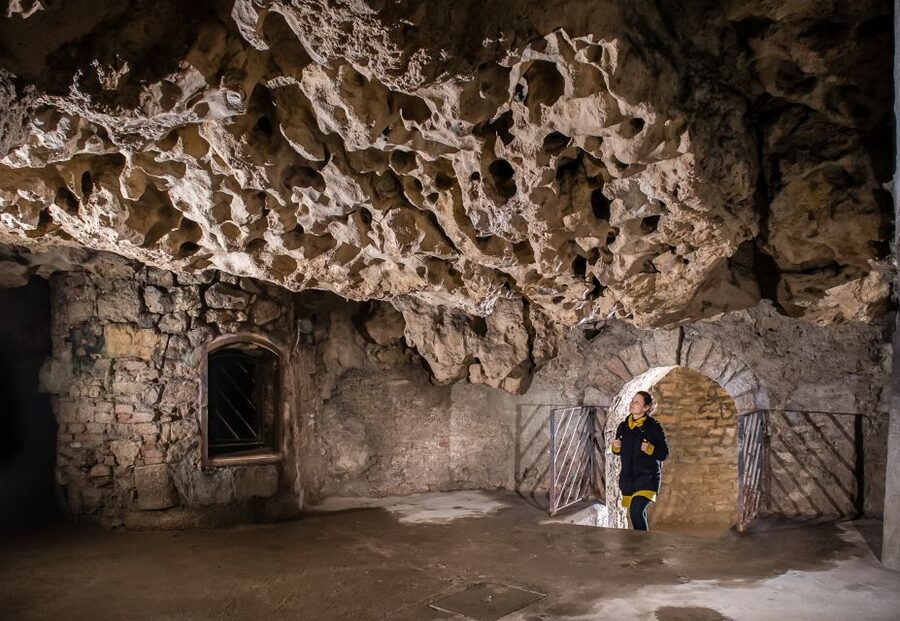 Budapest: Buda Castle Cave Tour - From medieval cellars to wartime shelters