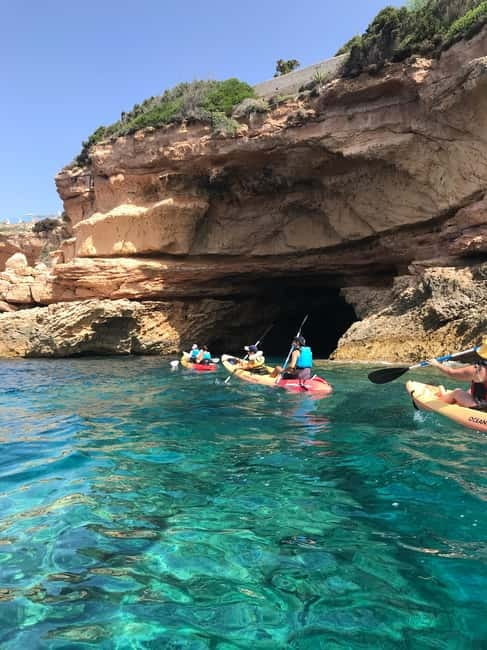Cala Codolar: Sea & Caves Kayaking Tour with Snorkeling - Getting ready at the pebbly Cala Codolar beach