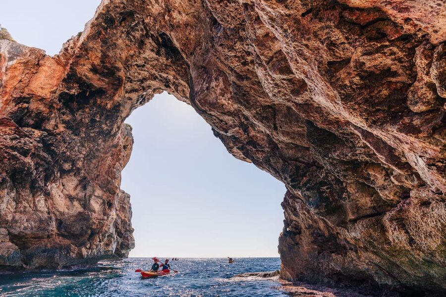 Cala Varques: Guided Sea Caves Kayak & Snorkeling Expedition - Paddling from Cala Romantica toward the caves