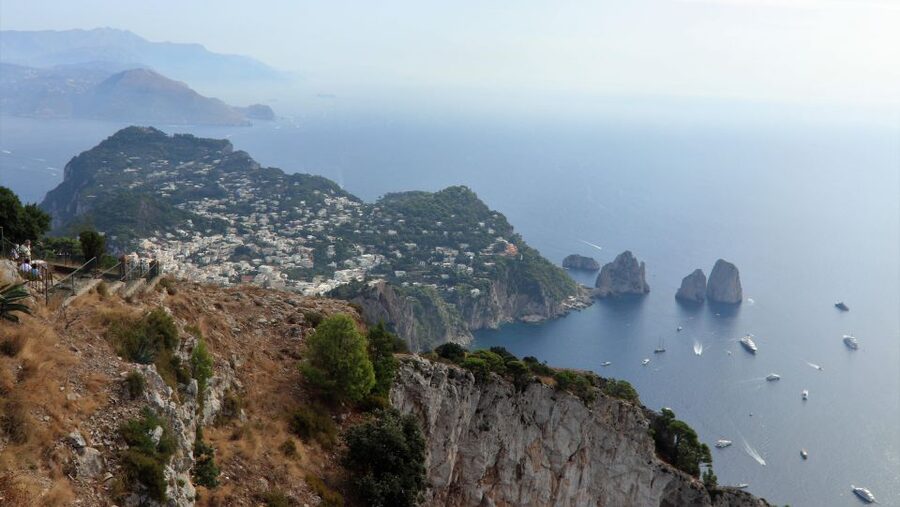 Capri and Anacapri tour: Faraglioni and Caves from Sorrento - The boat ride around Capri’s rocky coast
