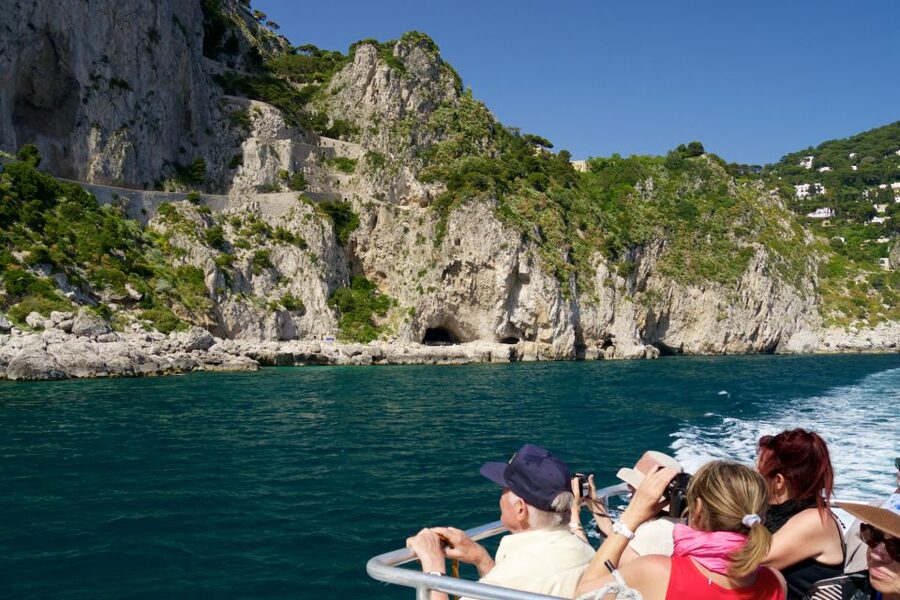 Capri: Guided Island Boat Tour With a Stop at the Caves - Leaving Marina Grande for the Scugnizzo statue