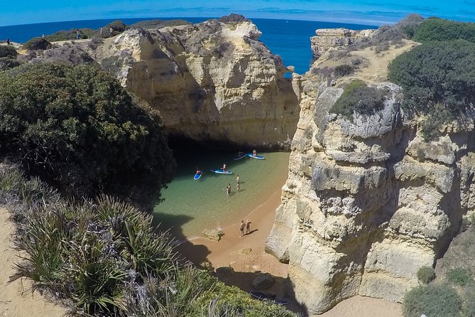 Cliffs & Caves Stand Up Paddle Adventure - Paddling beneath Albufeira’s ochre cliffs