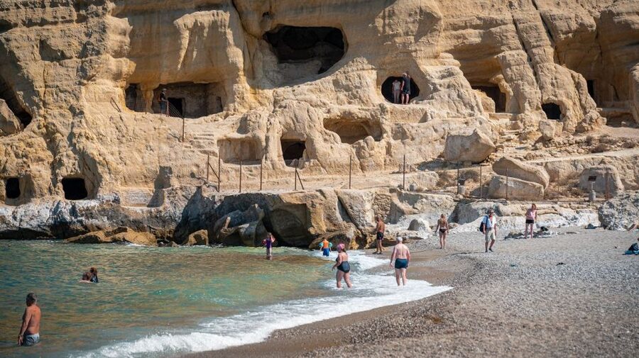 Crete: Matala Beach and Hippie caves, Red beach - Entering the hippie caves