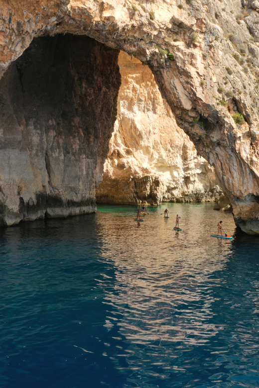 Explore Malta’s Blue Grotto by SUP - Swimming in Malta’s clear coastal water