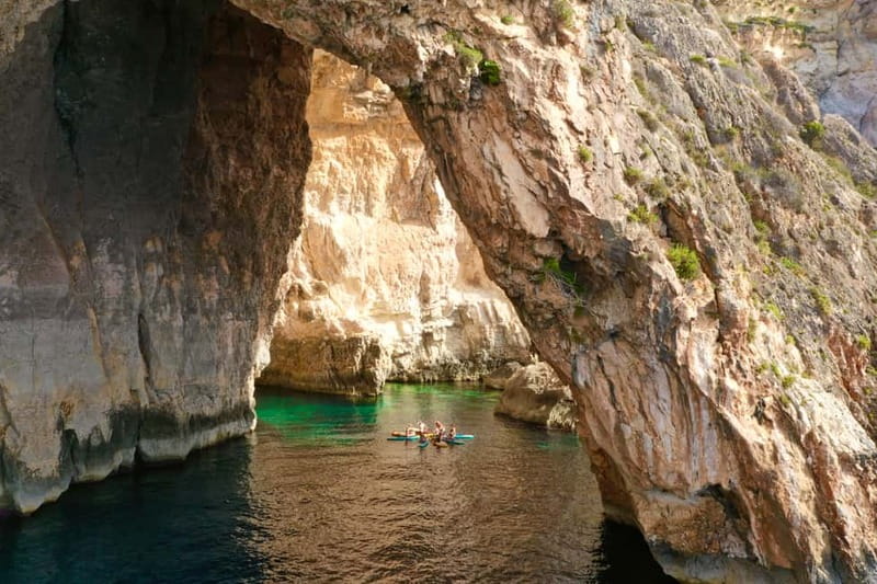 Explore Malta’s Blue Grotto by SUP - Paddling through Blue Grotto Bay