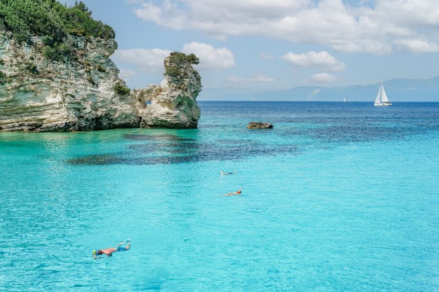 From Corfu Island: Antipaxos & Paxos Blue Caves Boat Cruise - Swimming From the Boat Near Antipaxos