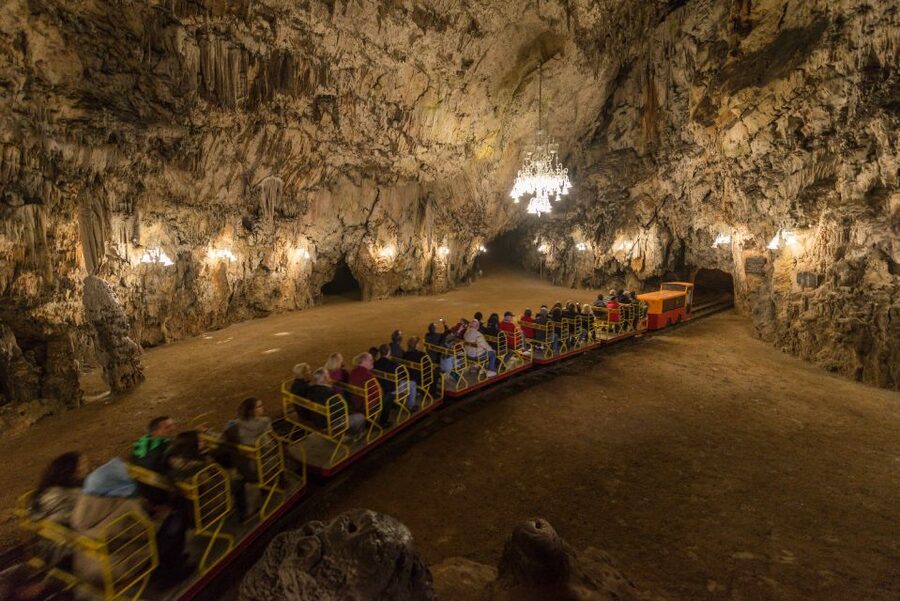 From Koper: 5-Hour Tour to Postojna Cave & Predjama Castle - Inside Postojna Cave by electric train