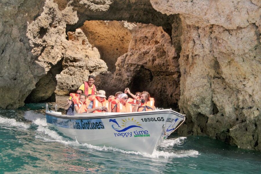 From Lagos: 2.5-Hour Guided Coastal Boat Tour & Grotto Visit - Swimming beside the cliffs and the aqua trampoline