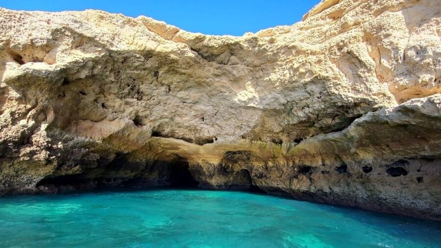 From Portimão: Algar de Benagil and Sea Caves Boat Tour - The return view from offshore