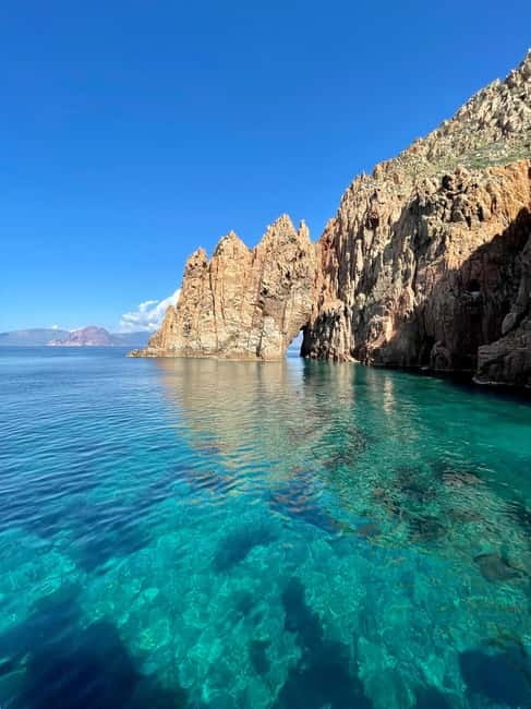 From Sagone/Cargèse: Piana Sea Caves & Snorkeling Boat Tour - Omigna Tower brings a little history to the water
