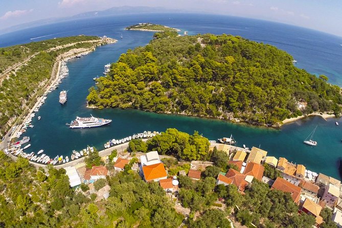 Full-Day Boat Tour of Paxos Antipaxos Blue Caves from Corfu - Paxos cliffs, white beaches, and the Blue Caves