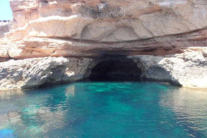 Ibiza Snorkeling Beach and Cave Tour - Cala Bassa: clear water and the cave entrance