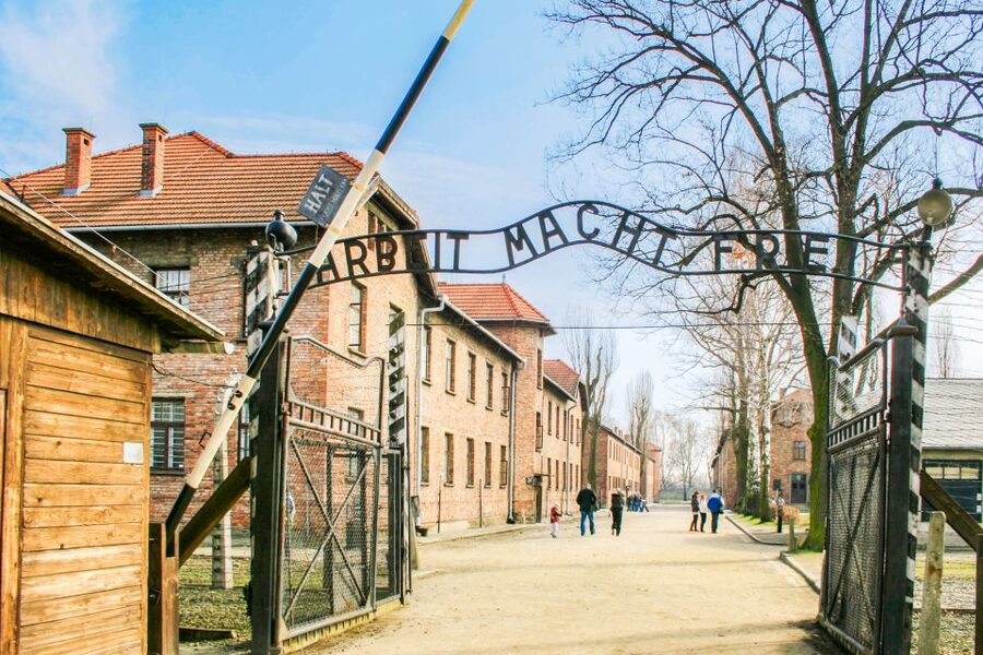 Krakow: Full-Day Auschwitz-Birkenau & Salt Mine Guided Tour - Entering Auschwitz-Birkenau with a guide