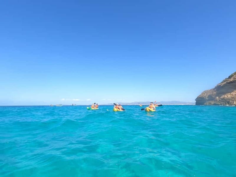 Mallorca: Sea Caves Kayaking Tour, Snorkeling & Snack - Paddling beneath the cliffs