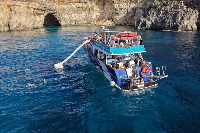 Malta: Blue lagoon, Gozo, Comino & Crystal Lagoon Sea Caves - The boat, slide, shade, and onboard routine