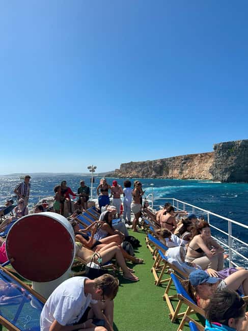 Malta: Gozo, Comino, Blue & Crystal Lagoon, & Caves Cruise - Getting the best place on board