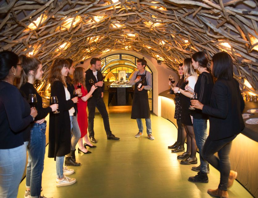 Paris: Les Caves du Louvre Guided Tour with Wine Tastings - A room-by-room lesson in how wine is made