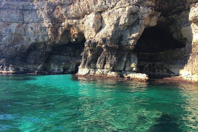 Polignano a Mare boat tour emotions, caves, diving and appetizers - Grotta Piana and the green water