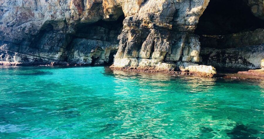 Polignano a Mare: Boat Trip, Swim & Cave with Aperitif - Entering Grotta Palazzese and the coastal grottos