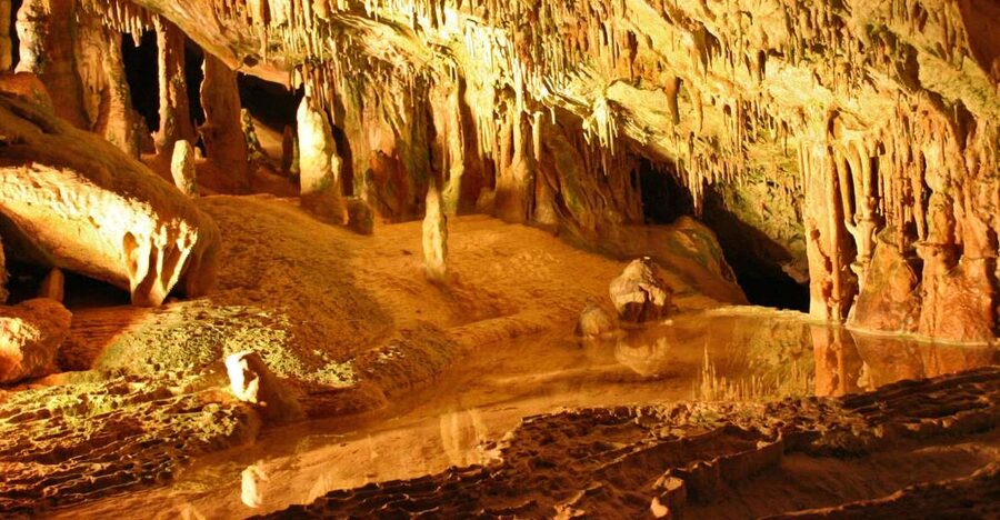 Puerto de San Miguel: Can Marçá Cave Guided Tour with Entry - Smugglers, secret marks, and the cave’s human side