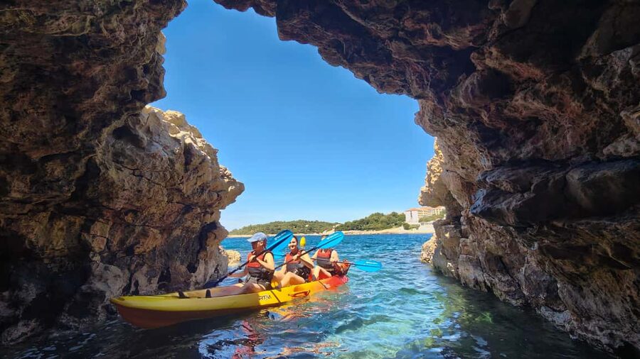 Pula: Cave Kayak Tour, Snorkeling and Island Jumping - Paddling the cave and spotting the pigeons
