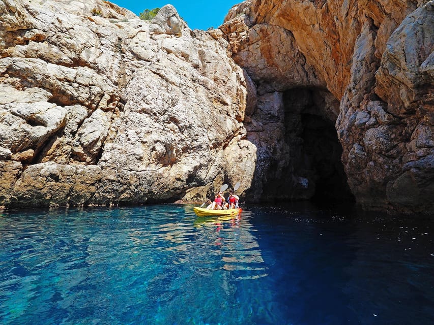 Sant Elm: Guided kayak tour to Cala en Tío with caves - Kayaking out from Sant Elm