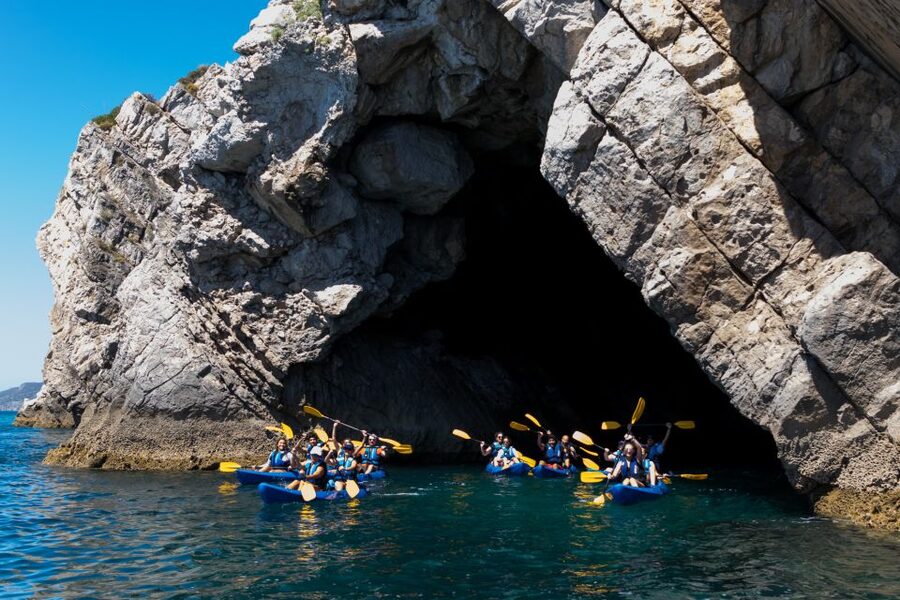 Sesimbra: Arrabida Natural Park & Caves Guided Kayaking Tour - Meeting at the blue kayaks in Sesimbra