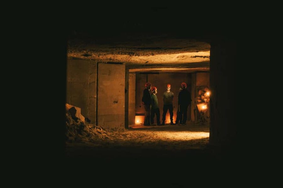 Valkenburg: Cave Biking Underground Bike Tour - Pedaling through high chambers and tight tunnels