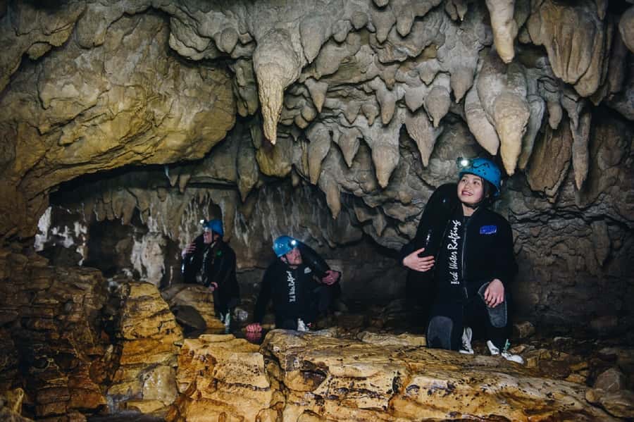 Waitomo Caves: Labyrinth Black Water Rafting Experience - Waterfall jumps and the underground river